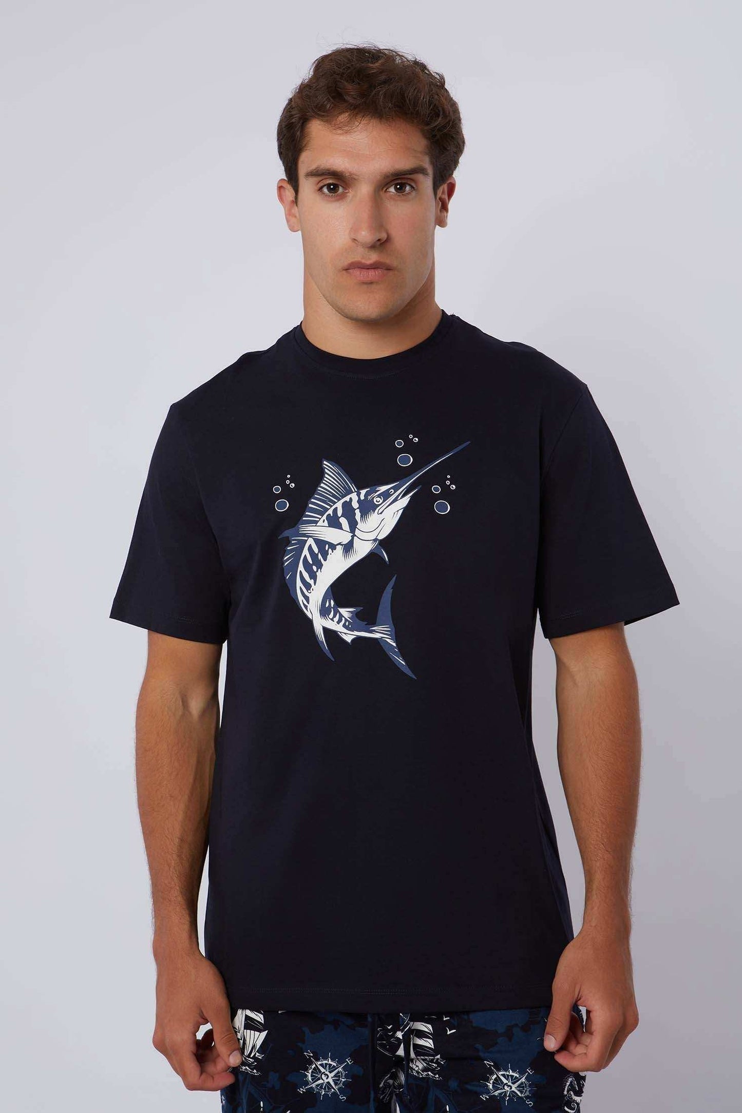 Dalydress men's navy t-shirt with swordfish graphic and patterned shorts, casual wear