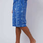 Man wearing blue Dalydress shorts with nautical anchor and wheel print, side view