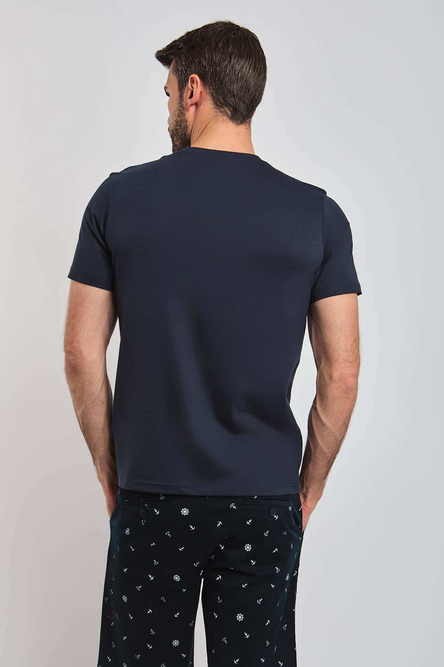 Men's navy blue Dalydress t-shirt and printed pants, back view against plain background