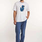 Dalydress men's casual wear with white printed t-shirt and blue pants, studio setting