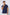 Man wearing Dalydress navy blue polo shirt with white trim, casual men's fashion.