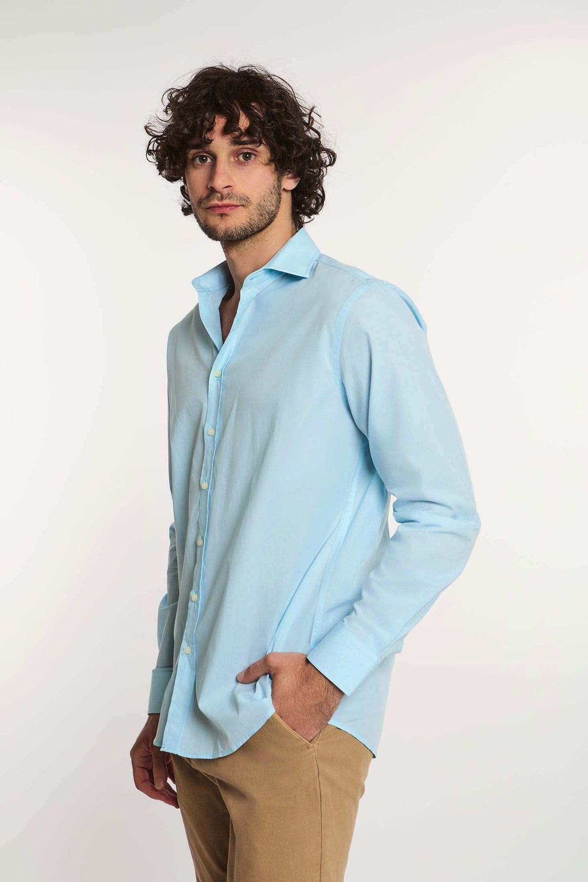 Dalydress menâ€™s casual light blue button-up shirt with beige pants, white background
