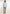 Man in light blue button-down shirt, beige pants, and brown shoes from Dalydress menswear collection