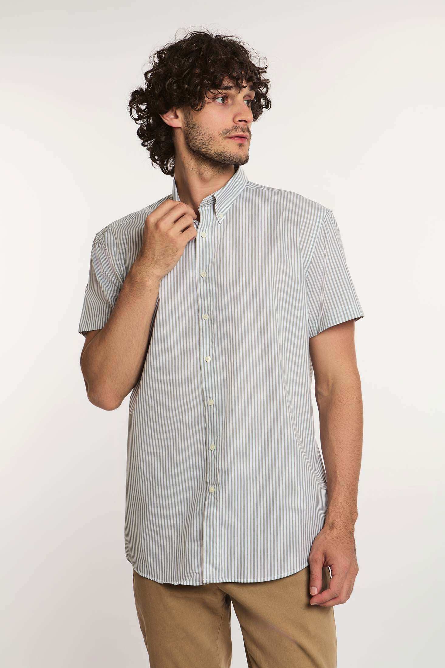 Man wearing Dalydress men's short sleeve striped button-down shirt with beige pants