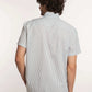 Back view of man wearing Dalydress men's short sleeve striped shirt and beige pants