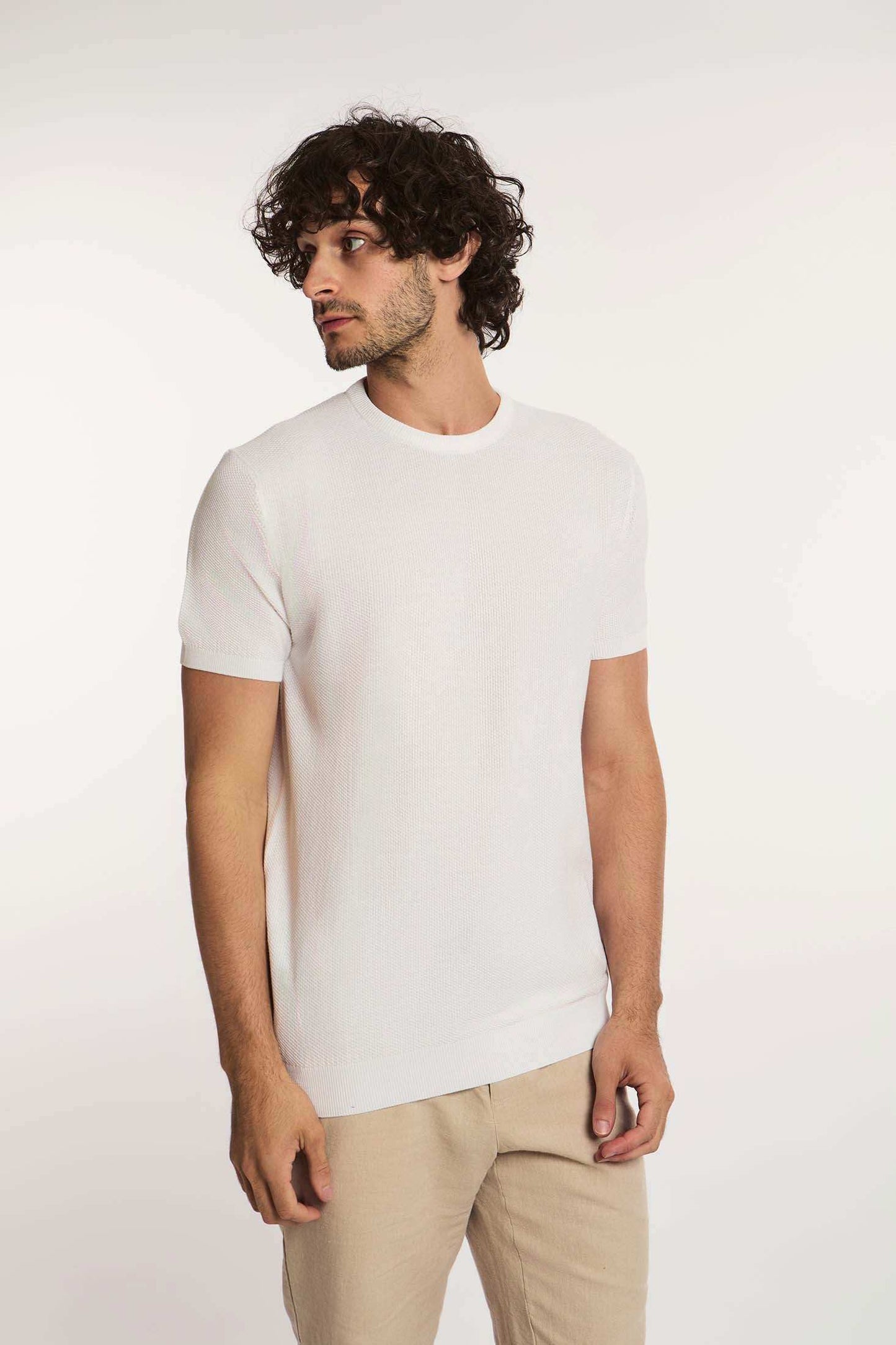 Dalydress men's casual white short-sleeve knit shirt with beige pants, studio background