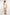 Dalydress casual men’s fashion: white t-shirt, beige shorts, brown slip-on shoes