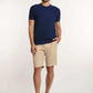 Dalydress men's casual look with navy t-shirt, beige shorts, and brown slip-on shoes