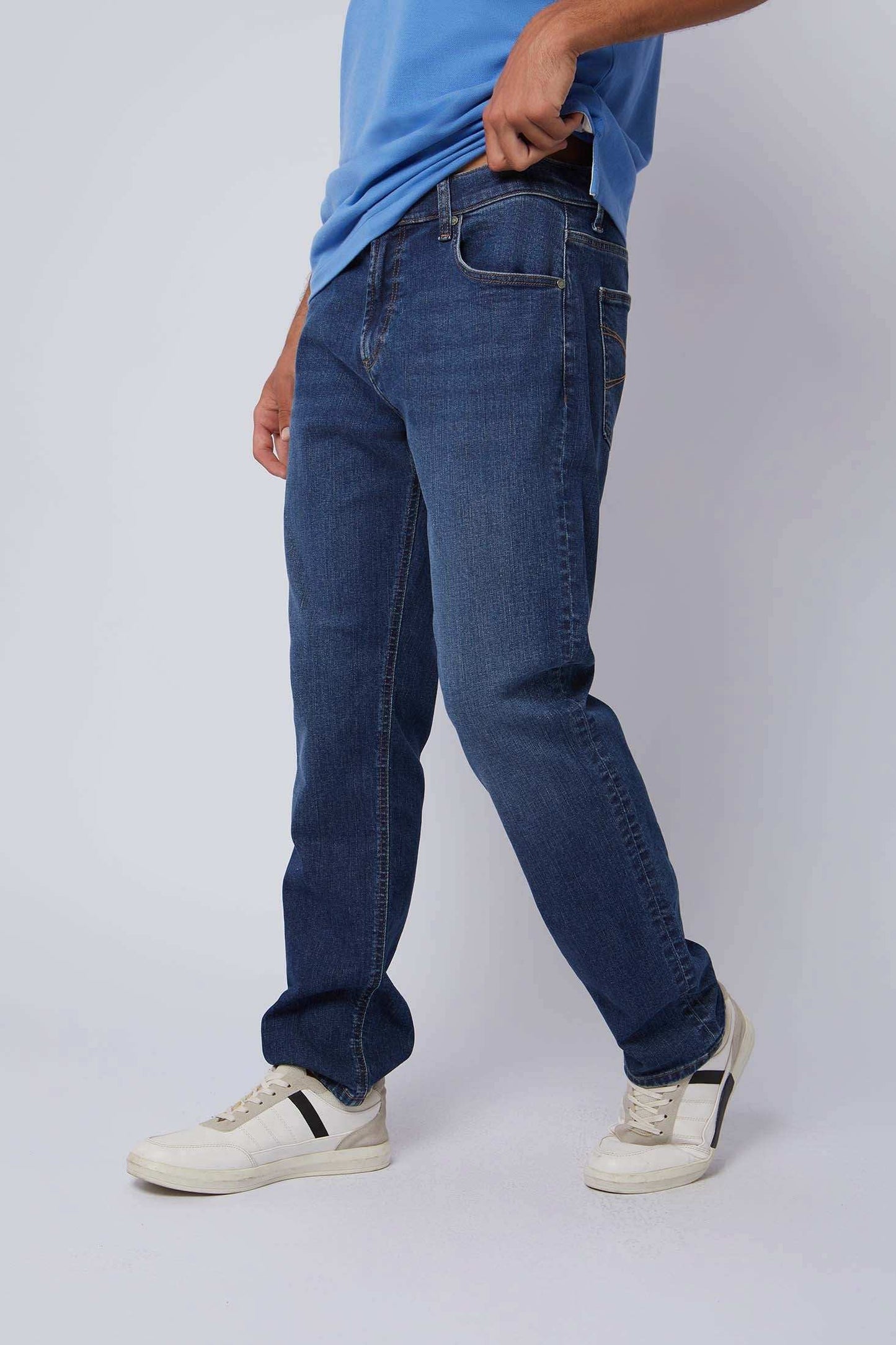 Dalydress men's casual blue jeans with classic fit, styled with white sneakers.