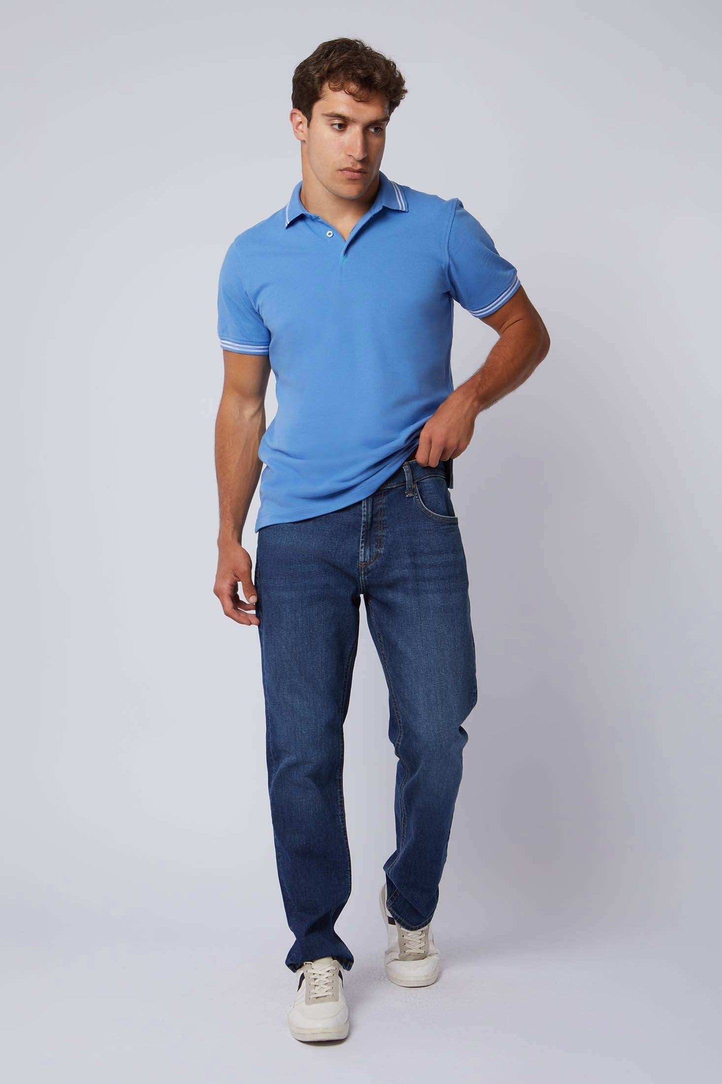 Dalydress men's casual fashion, model in blue polo shirt and jeans, white sneakers