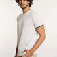 Man modeling Dalydress casual white short-sleeve shirt with striped sleeve detail