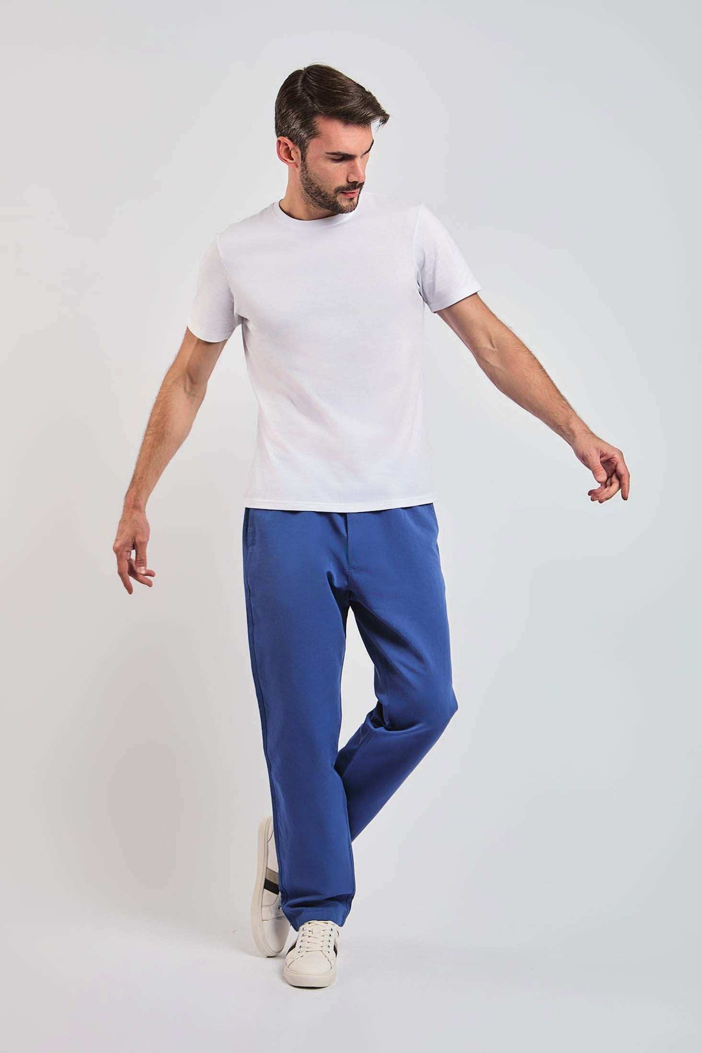 Dalydress men's white t-shirt and blue pants casual outfit, model standing, studio background