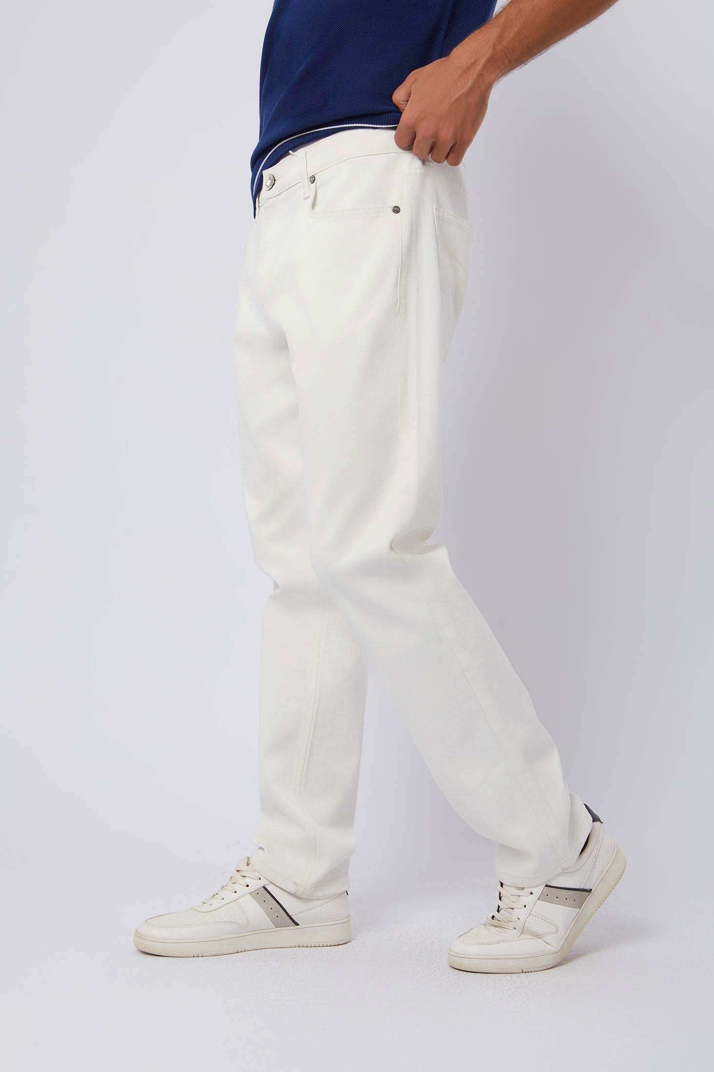 Dalydress men's white jeans styled with white sneakers and a navy blue shirt