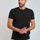 Man wearing Dalydress black t-shirt and grey joggers, casual menswear fashion