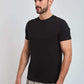 Dalydress men's black crew neck t-shirt with short sleeves, modeled with grey pants