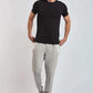 Dalydress men's casual outfit with black t-shirt, grey jogger pants, and white sneakers