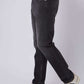 Dalydress men's black jeans styled with white sneakers and a coral shirt, side view