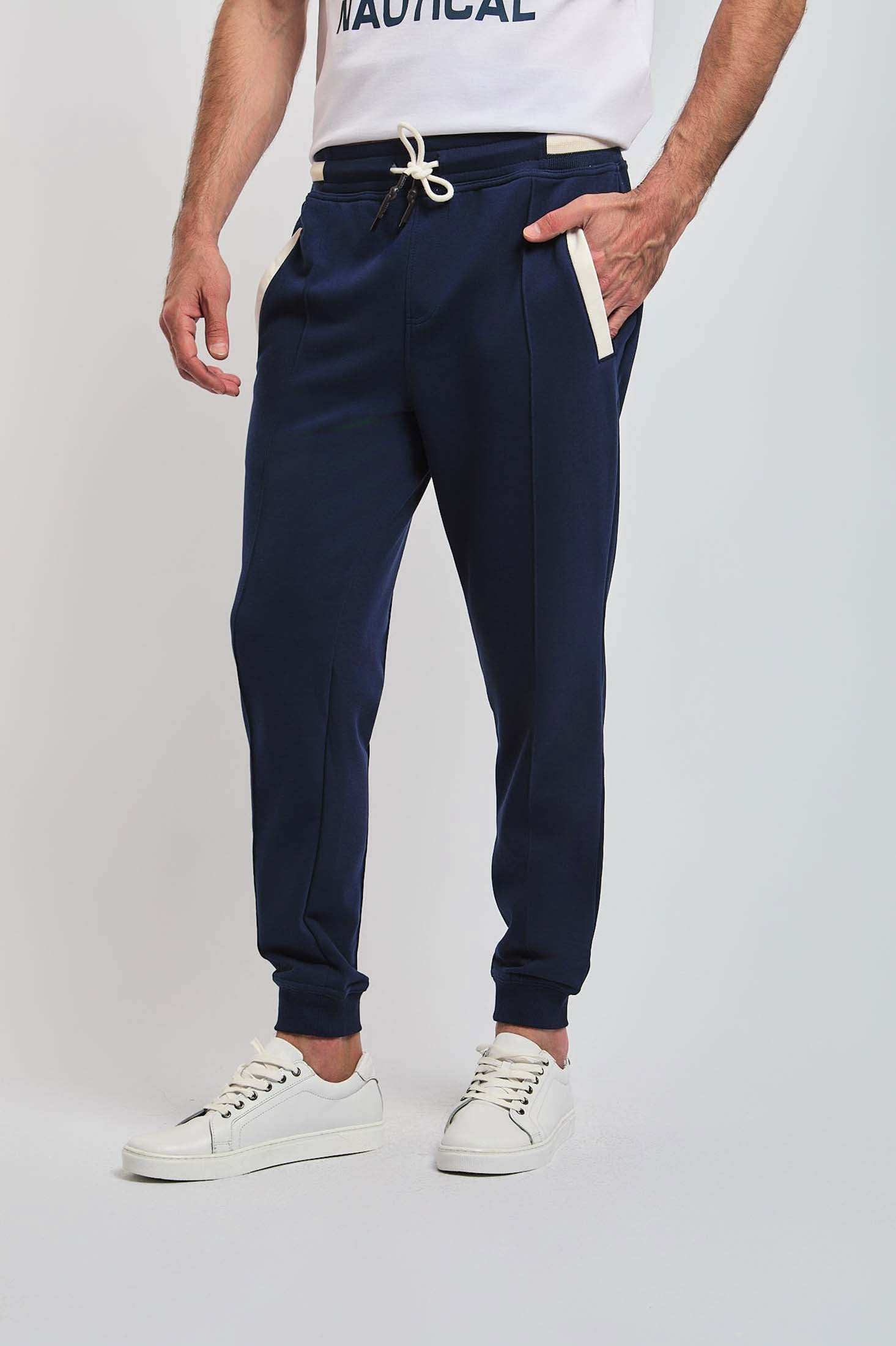 Dalydress men's navy joggers with white drawstring and pockets, paired with white sneakers