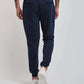 Dalydress men's navy jogger pants with back pockets, white sneakers, and white waistband