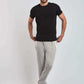 Dalydress men's casual outfit with black t-shirt, grey joggers, and white sneakers