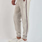Dalydress men's casual grey sweatpants with side stripes and drawstring, styled with white sneakers