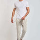Dalydress men's casual wear, model in white t-shirt, beige pants, white sneakers