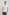 Man wearing fitted white short sleeve t-shirt with subtle circular design, brown pants