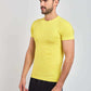 Man wearing slim fit yellow t-shirt with subtle geometric print and black pants