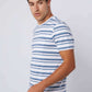 Man wearing a blue and white striped short-sleeve t-shirt and denim jeans