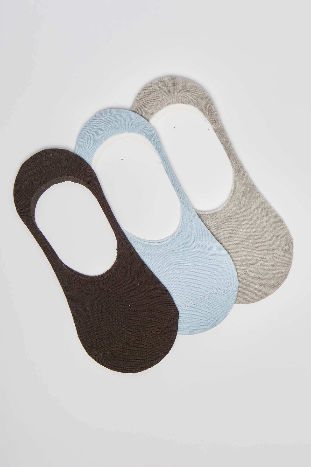 Set of three no-show socks in black, light blue, and grey on white background