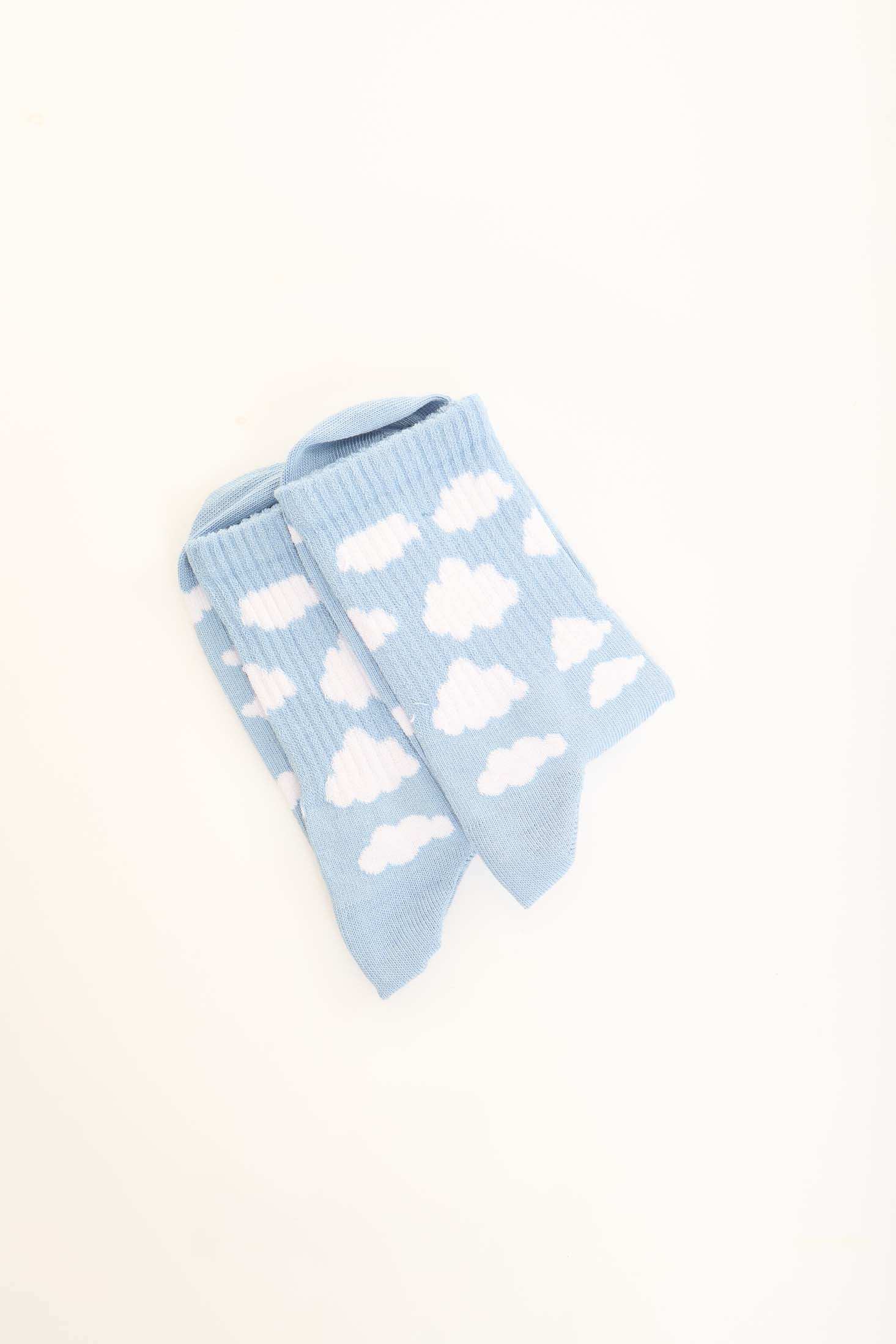 Light blue socks with white cloud pattern on plain background