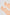 Peach low-cut socks with white polka dots on a plain background