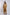 Woman wearing camel brown kimono-style long cardigan with matching wide-leg pants and strappy heels