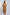 Woman wearing a loose camel brown long tunic top and matching pants, back view