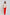 Woman wearing white embroidered blouse with tassels and bright red trousers