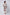 Woman wearing a long cream dress with colorful floral and geometric patterns, back view