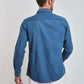 Man in blue denim long sleeve shirt and white pants, back view, casual fashion
