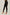 Women's high-waisted black skinny pants styled with beige heels on a neutral background