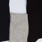 Set of three men's socks in black, grey, and dark navy on white background