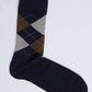 Navy blue sock with brown and gray argyle pattern on white background