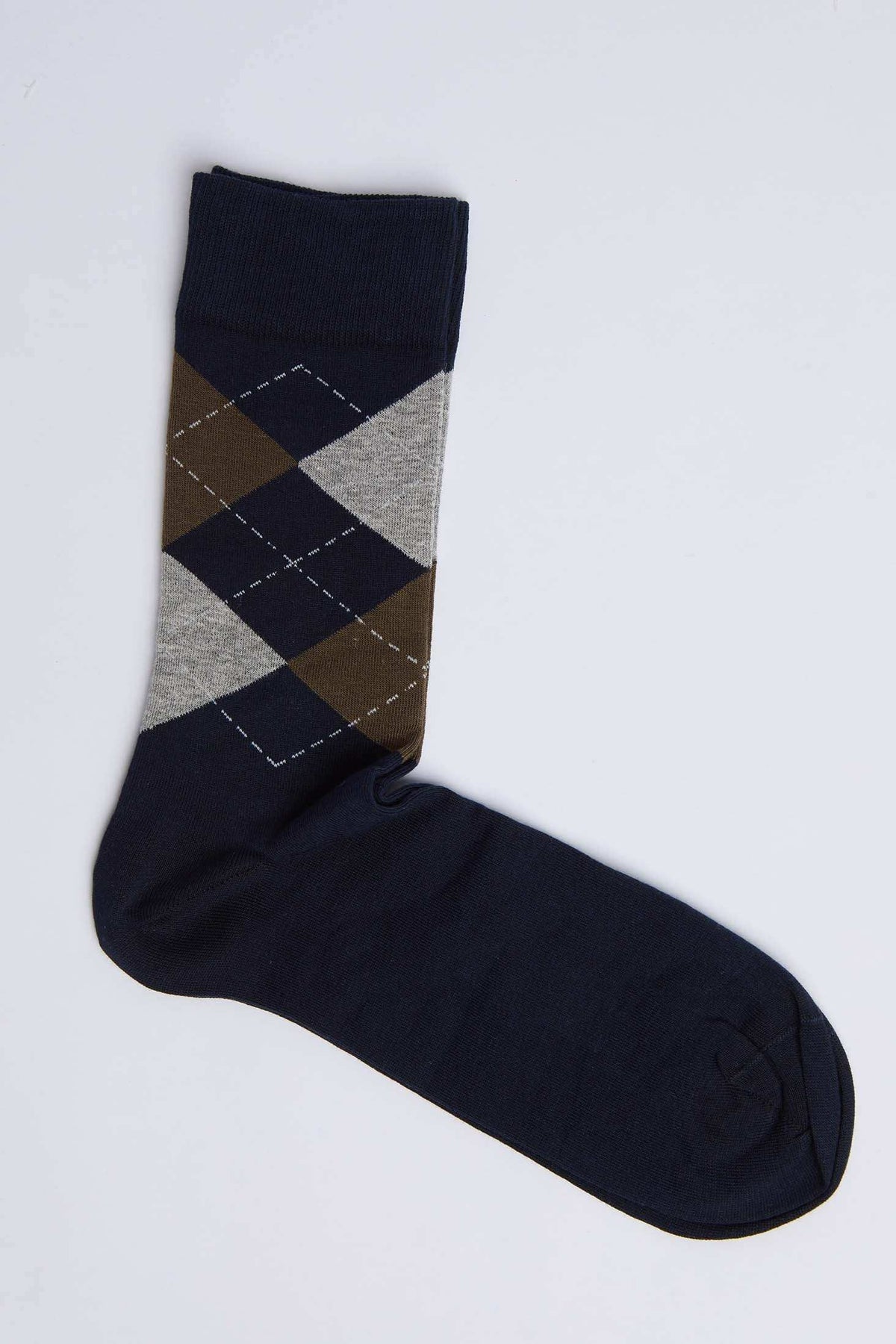Navy blue sock with brown and gray argyle pattern on white background