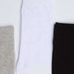 Three pairs of crew socks in grey, white, and black on a white background