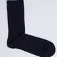 Plain black men's dress sock on a white background