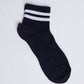 Black ankle sock with white double stripes on ribbed cuff, casual style on white background