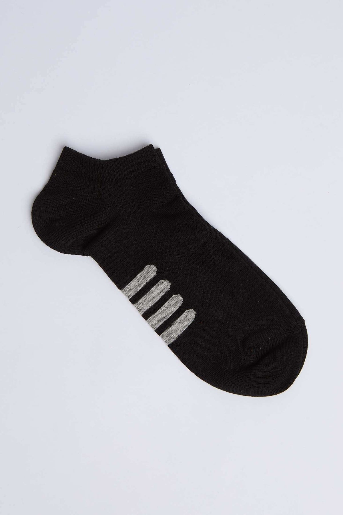 Black ankle sock with grey stripe accents, athletic casual wear on white background