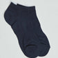 Pair of plain black ankle socks on a white background