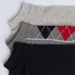 Set of three men's socks in grey, argyle pattern, and solid black on white background