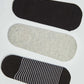 Set of three no-show socks in black, grey, and black with white stripes on a white background