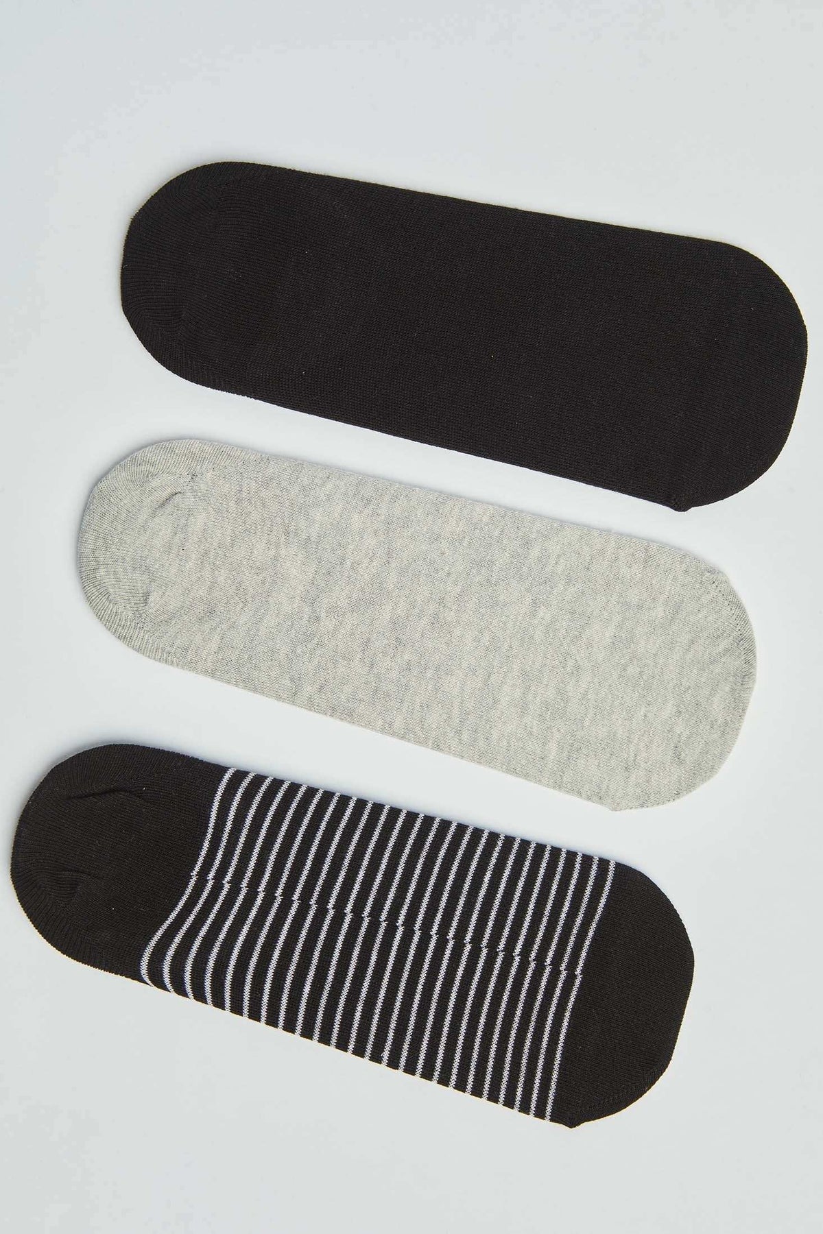 Set of three no-show socks in black, grey, and black with white stripes on a white background
