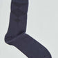 Navy blue sock with subtle diamond pattern, men's fashion accessory on white background
